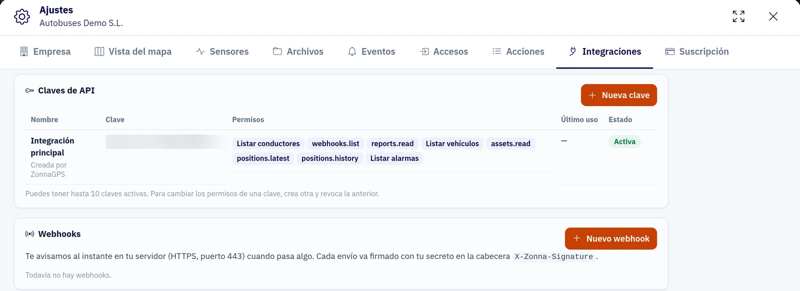 Pestaña Integraciones de los ajustes de ZonnaGPS: claves de API con sus permisos y estado, y webhooks firmados con la cabecera X-Zonna-Signature